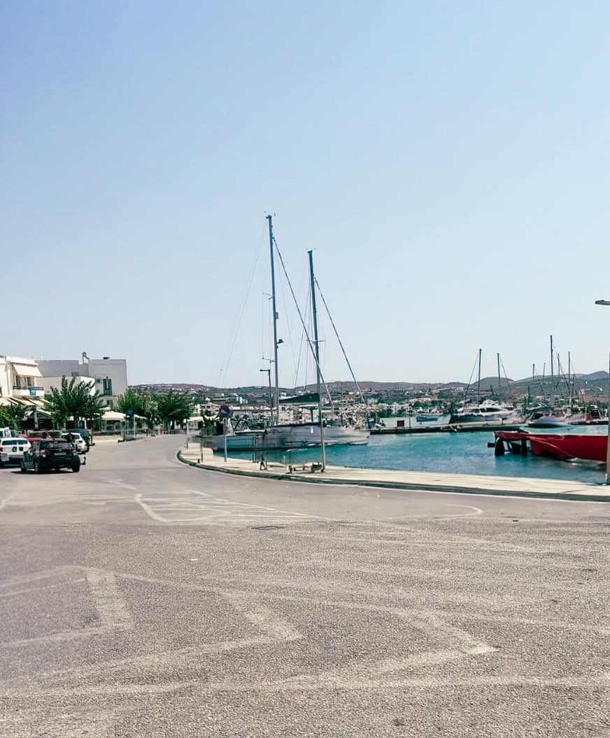 View of boats in the harbor in Adamas, the main port of Milos.
